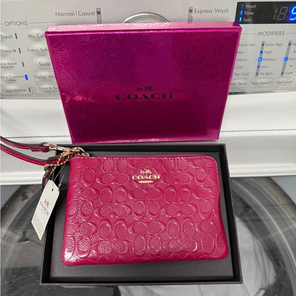 Coach Fuchsia Embossed Wristlet